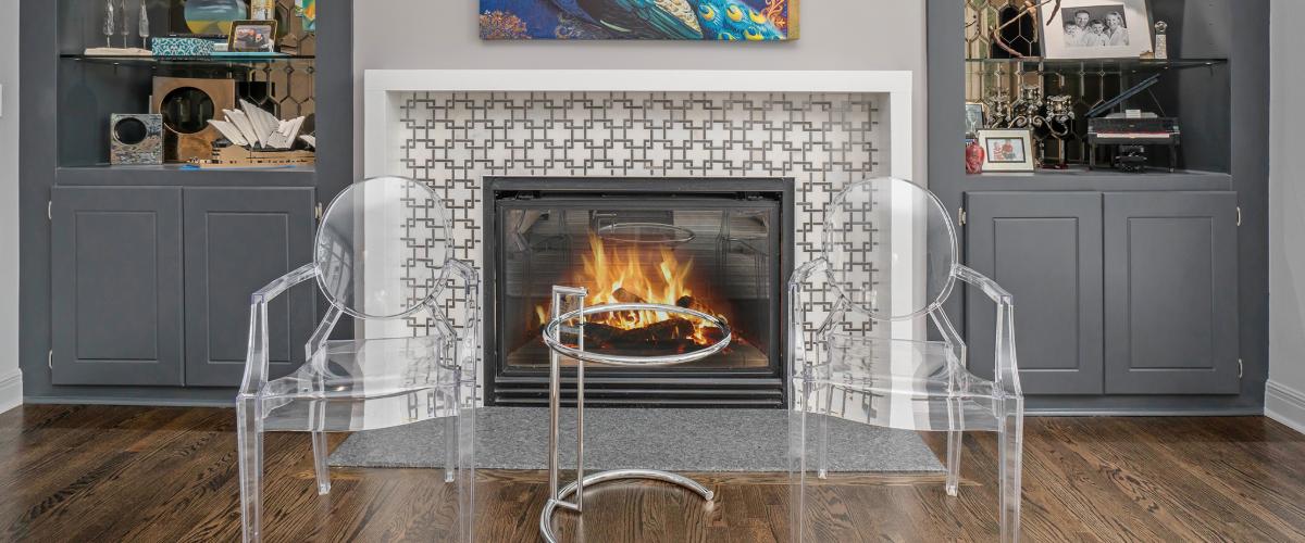 Fireplace remodel with clear chairs
